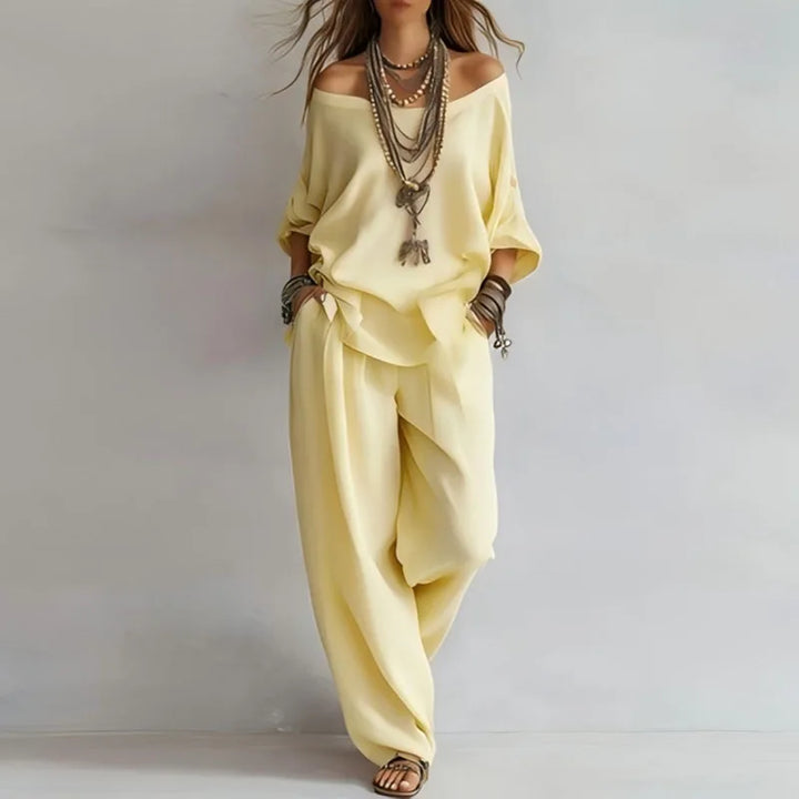 Side angle showing wide-leg trousers and loose silhouette of two-piece co-ord set