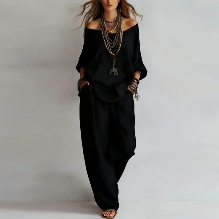Back view of off shoulder top showing relaxed drape and three-quarter sleeve construction