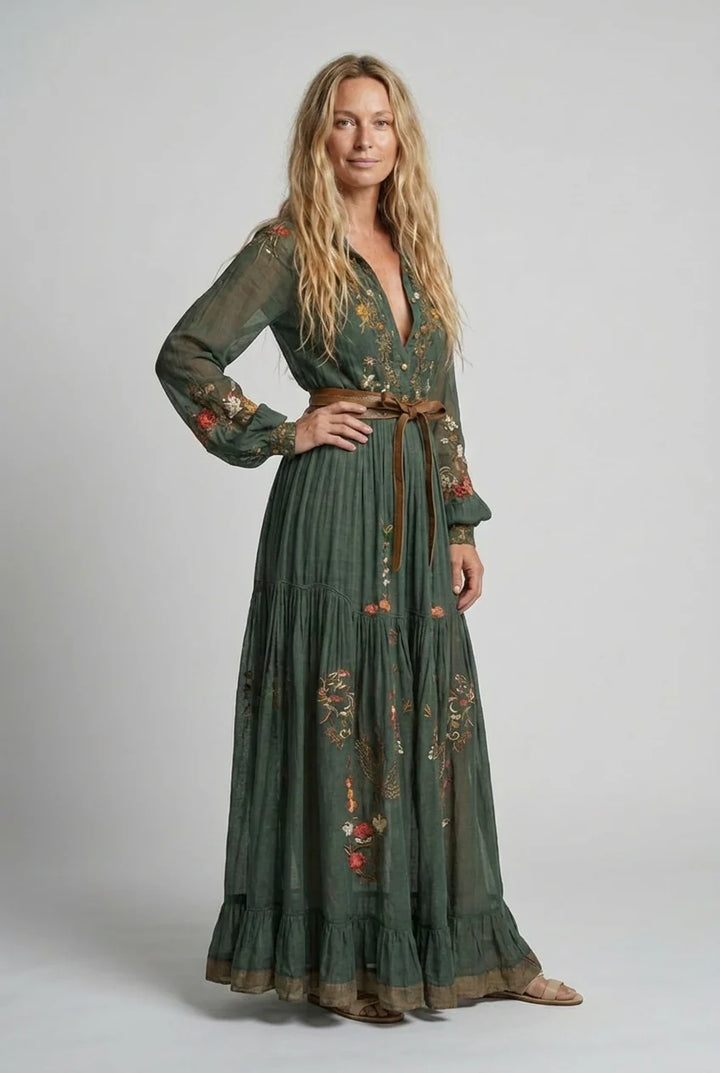 Close-up of floral embroidery detail on maxi dress bodice with sheer balloon sleeves