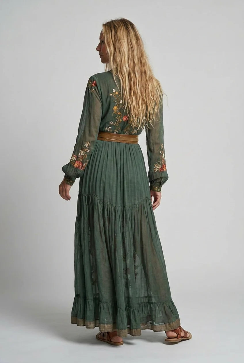 Back view of embroidered maxi dress with button-front closure and flowing skirt