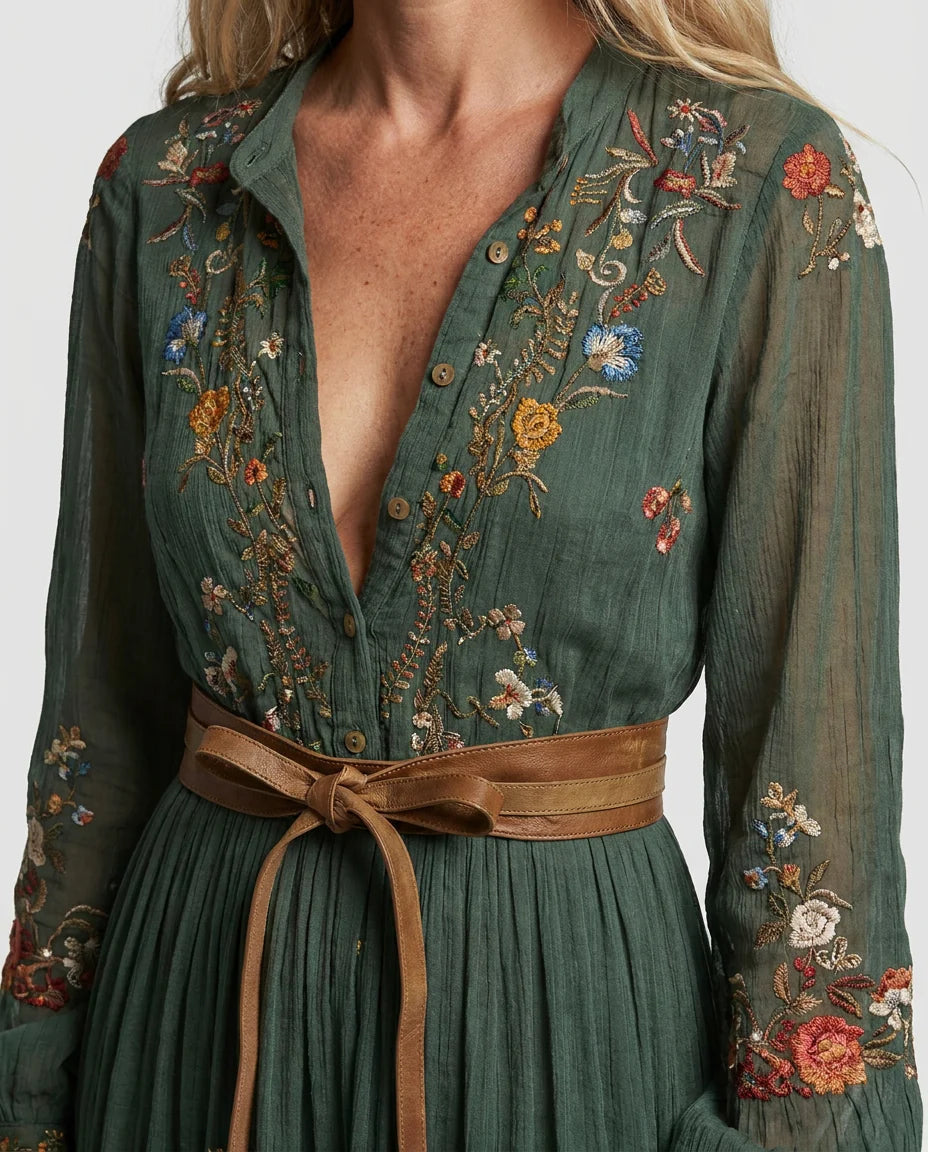 Full-length embroidered maxi dress with V-neck and tiered ruffle hem in outdoor setting