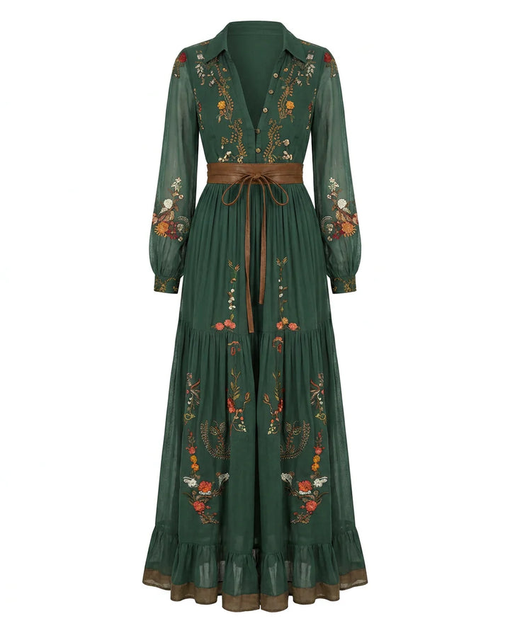 Detail of sheer balloon sleeves with floral embroidery and button cuffs on maxi dress