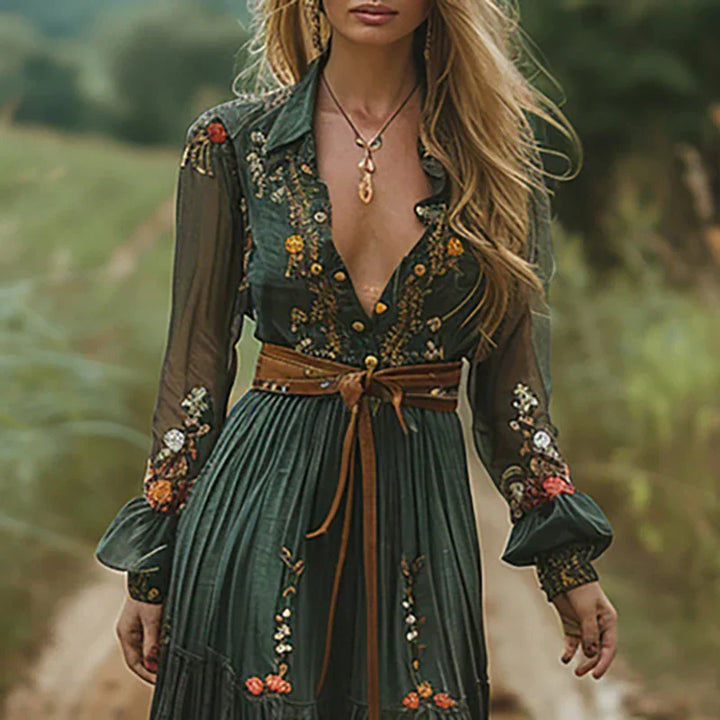 Front view of embroidered maxi dress with V-neckline and all-over floral embroidery pattern