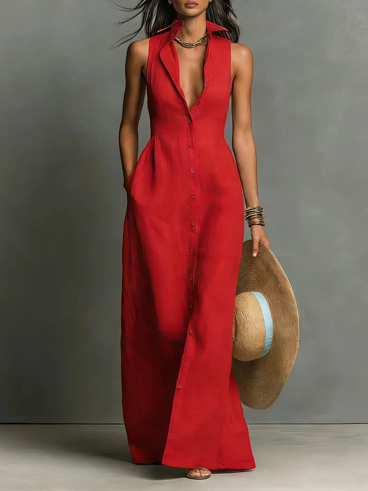 Red sleeveless maxi shirt dress with lapel collar and button-front closure, tailored waist, floor-length hem