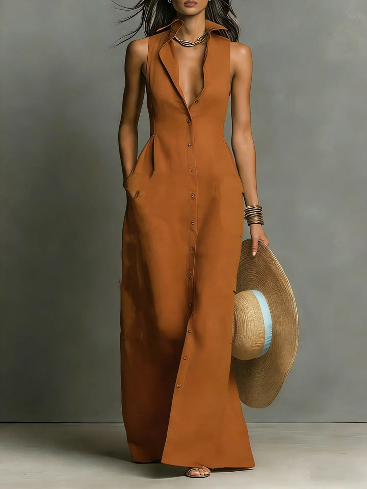 Model wearing red lapel collar maxi dress with strappy sandals and statement accessories