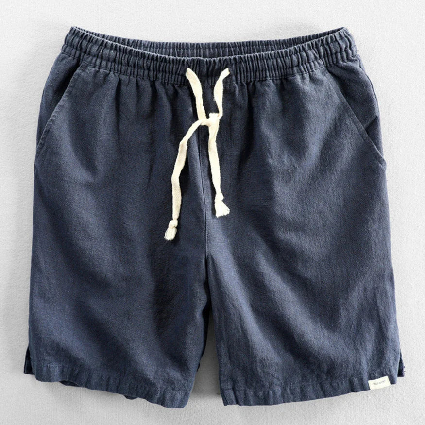 Close-up view of men's chino shorts showing textured fabric and adjustable drawstring closure at waist