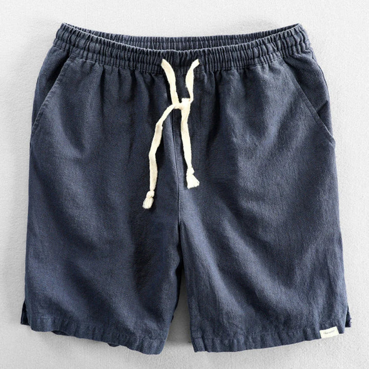 Close-up view of men's chino shorts showing textured fabric and adjustable drawstring closure at waist