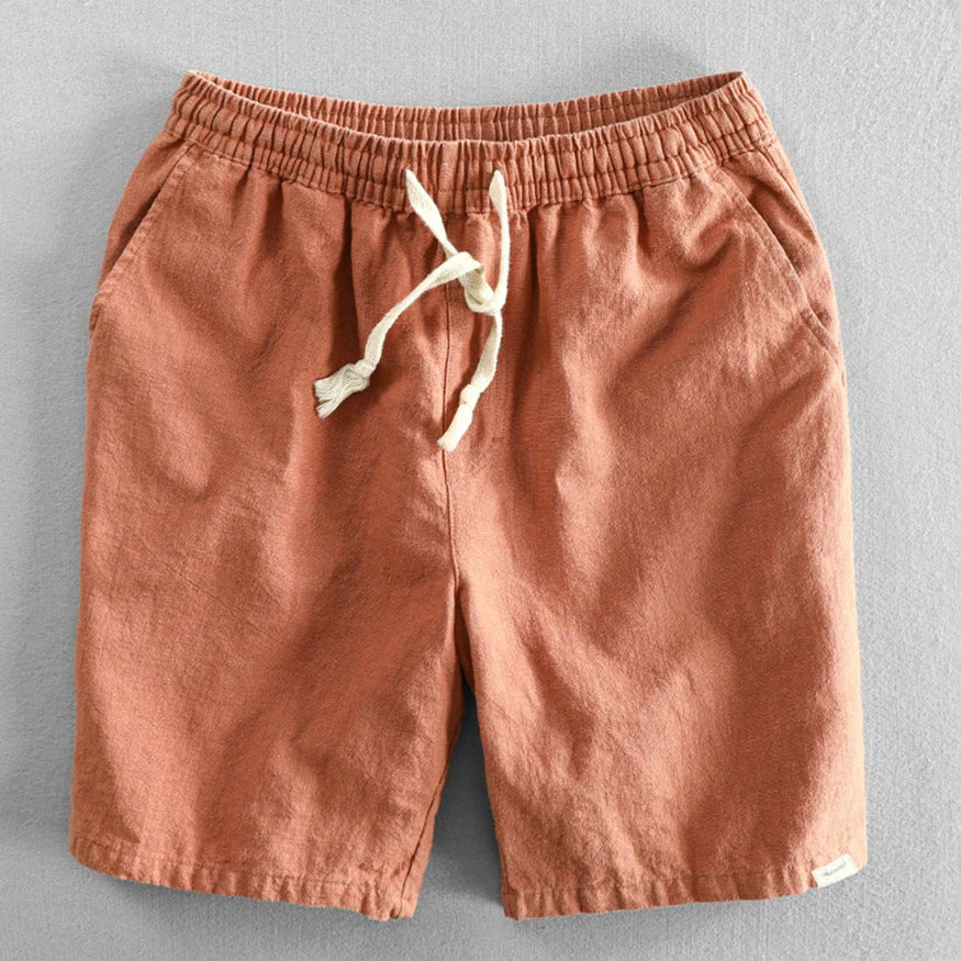 Men's mid-thigh chino shorts in navy blue with side pockets and adjustable waist