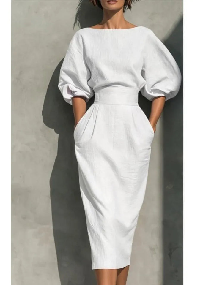 Close-up of high waist pleated midi dress with functional side pockets and zip closure