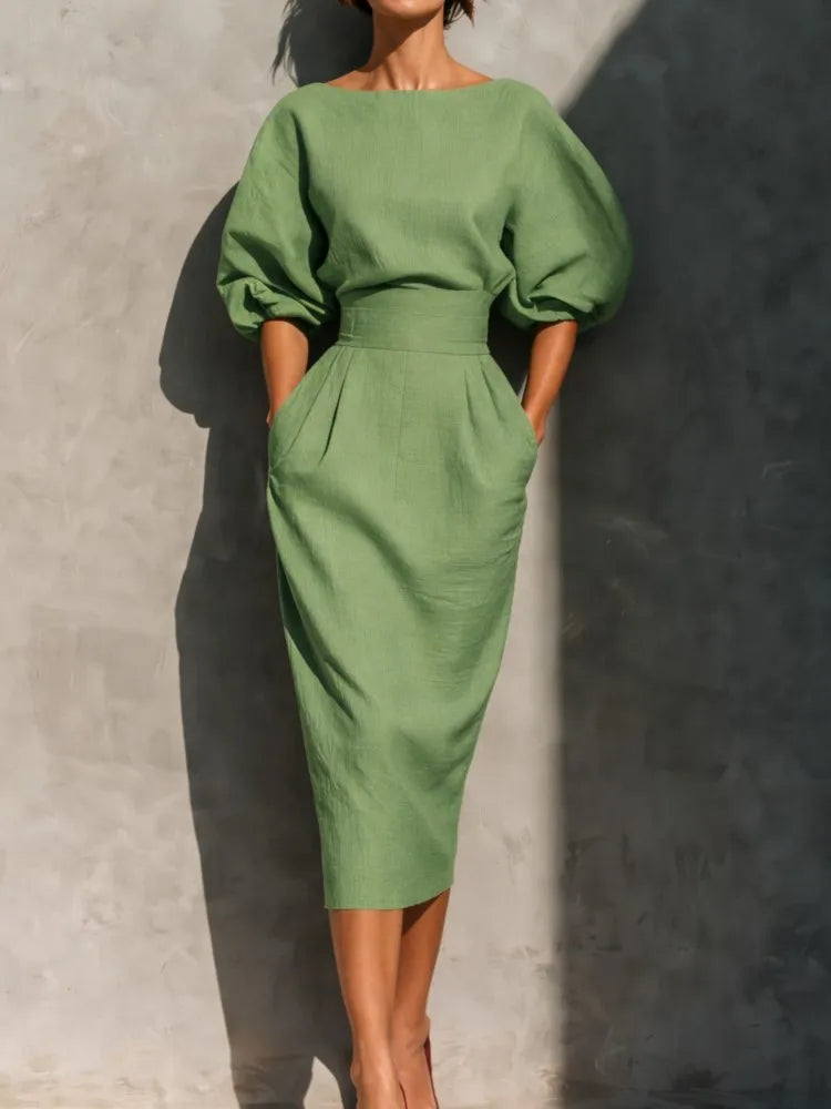 Full-length midi dress with lantern sleeves styled for formal and office occasions