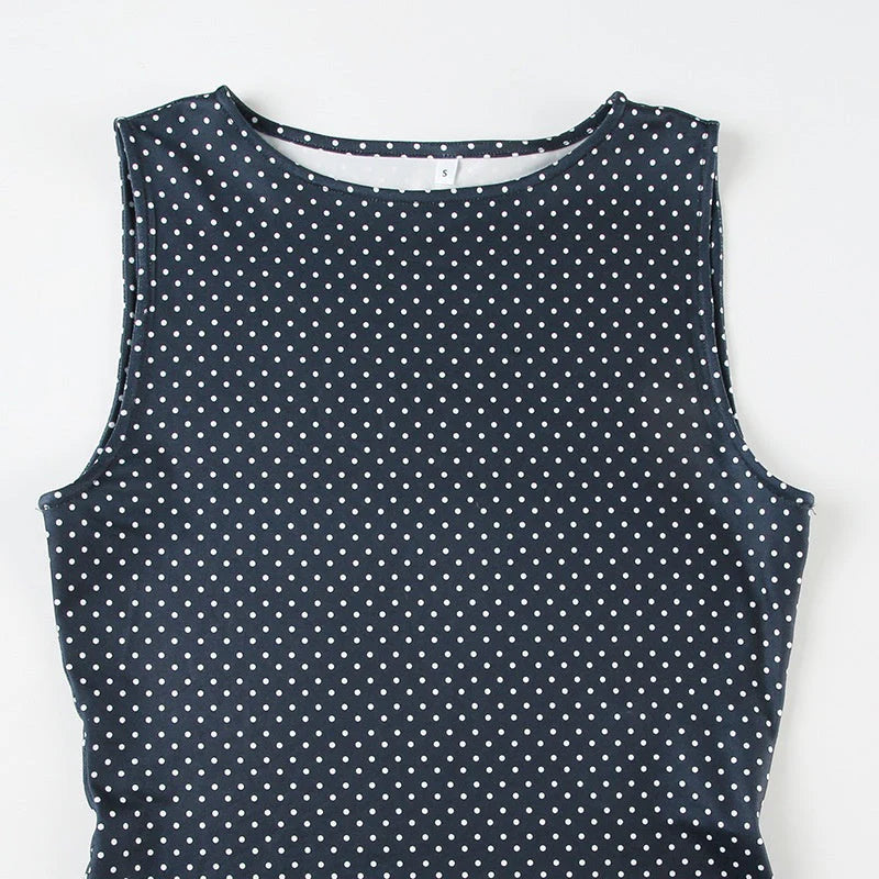 Full-length view of sleeveless polka dot mini dress blue paired with casual accessories