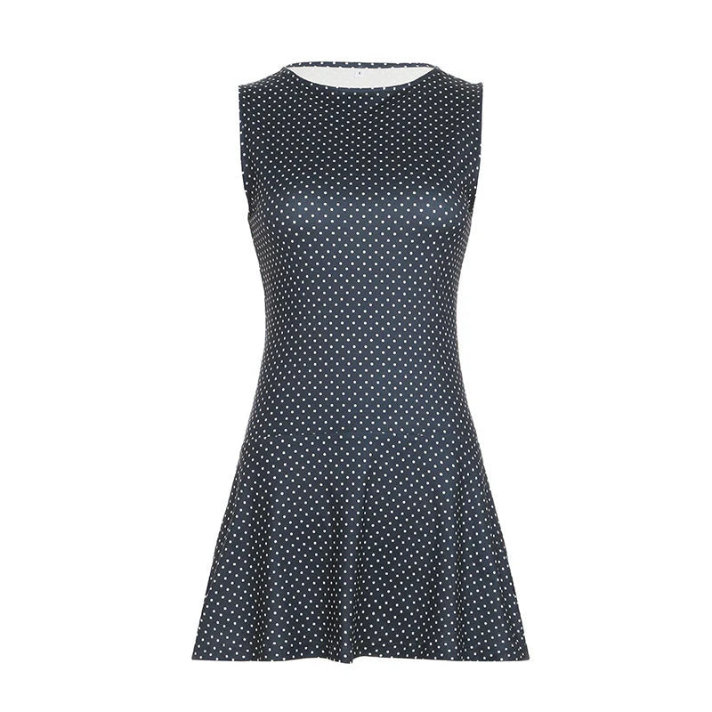 Flared hem detail on sleeveless polka dot mini dress blue showing movement and drape