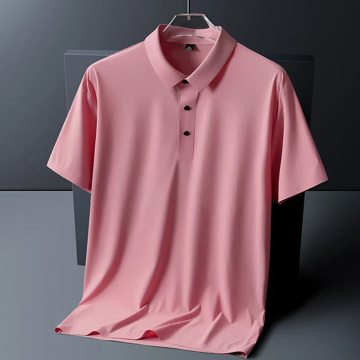 Men's short sleeve polo shirt in pink with classic collar and button placket on hanger