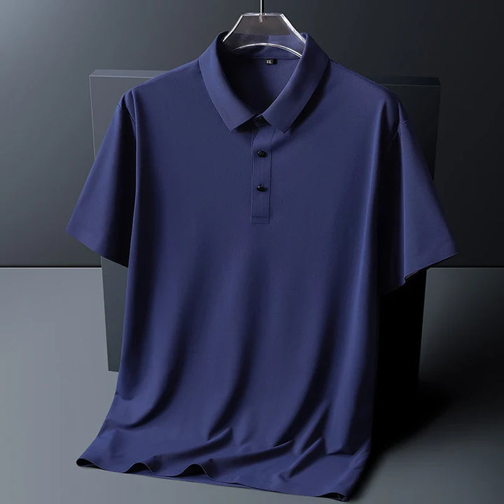 Side angle of men's short sleeve polo shirt showing drape and straight hem
