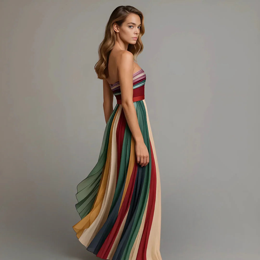 Detail of striped bodice and pleated skirt on strapless maxi dress for evening occasions