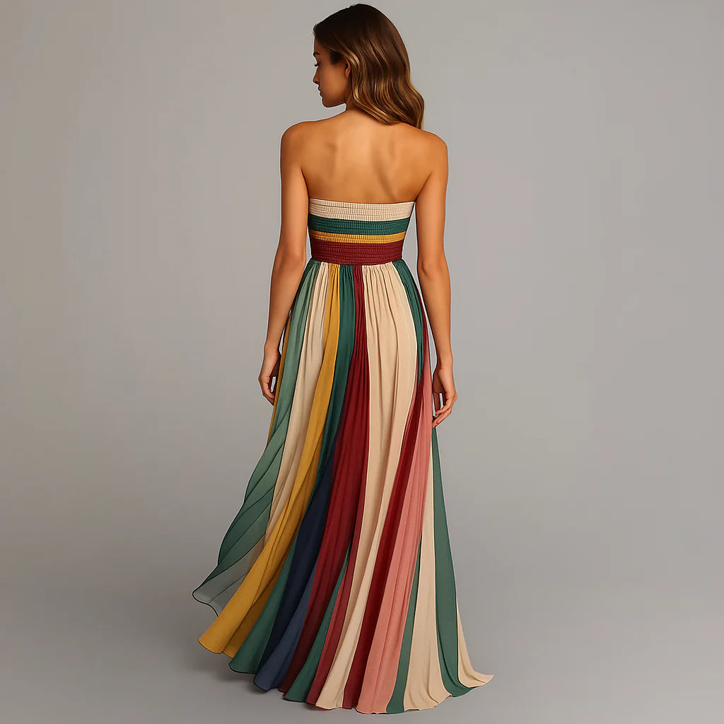 Full-length view of strapless striped maxi dress with floor-length pleated skirt