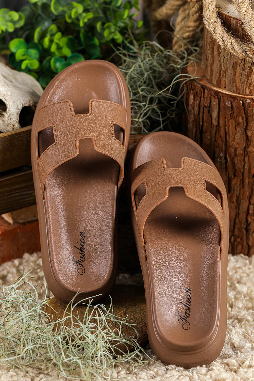 Side angle of platform slippers displaying supportive sole height and slip-on construction for easy wear
