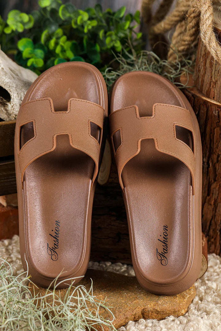 Top view of orthopedic platform slippers highlighting the geometric cut-out pattern across the upper