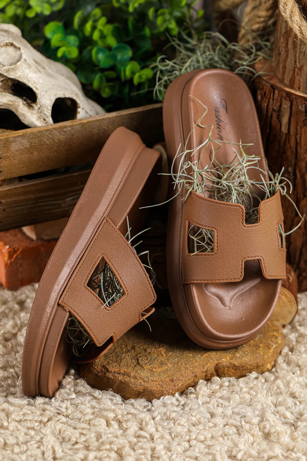 Pair of Women's Chic Orthopedic Platform Slippers in beige colorway on natural wood surface