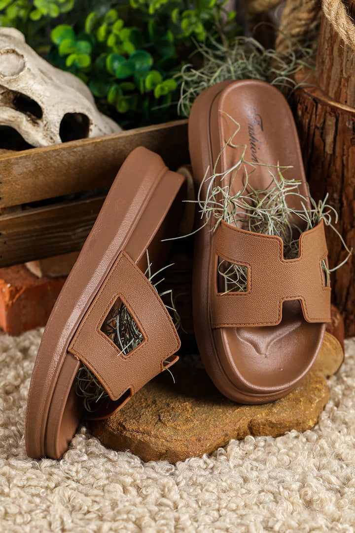 Pair of Women's Chic Orthopedic Platform Slippers in beige colorway on natural wood surface