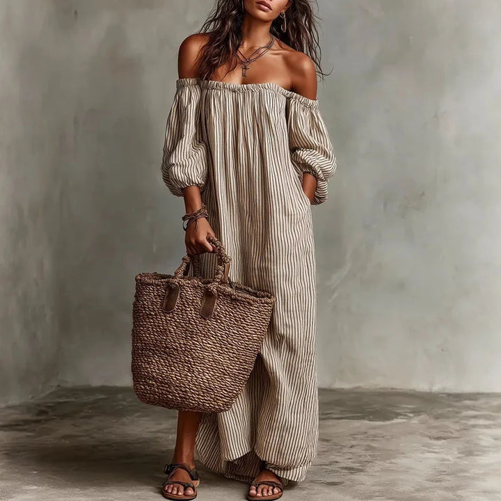 Off shoulder dress with vertical stripe pattern and puff sleeves in relaxed maxi length silhouette