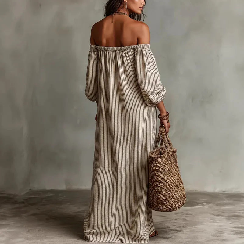 Side view of striped off shoulder dress showing elastic neckline and voluminous sleeve detail
