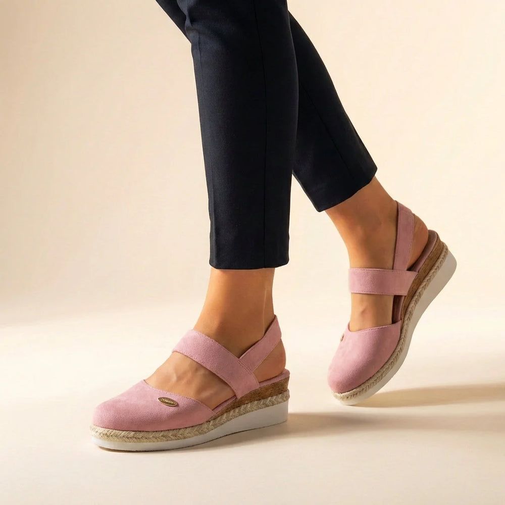 Side view of espadrille platform sandals showing natural jute trim and slingback design with adjustable closure