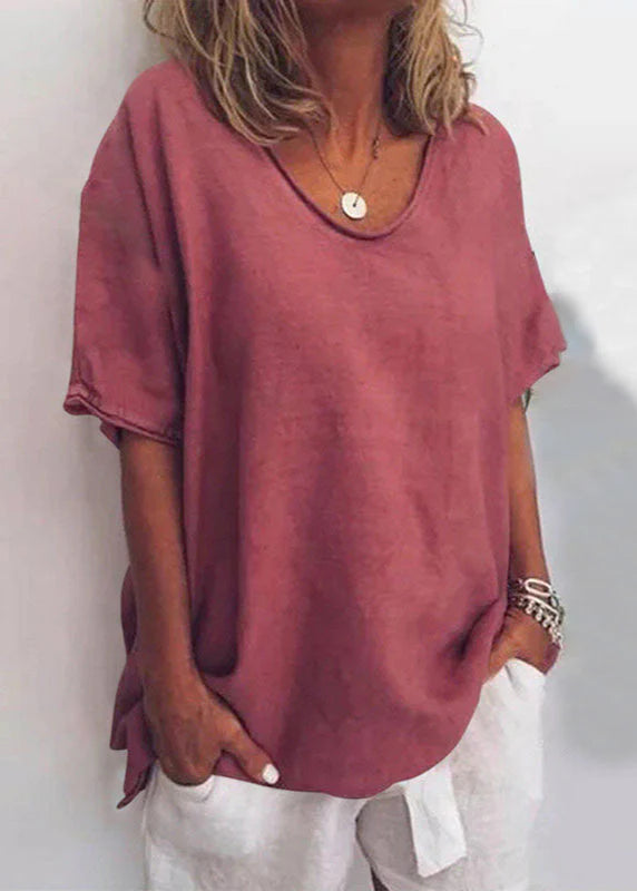 Women's cotton summer blouse in dusty rose with relaxed fit and V-neckline worn with white pants