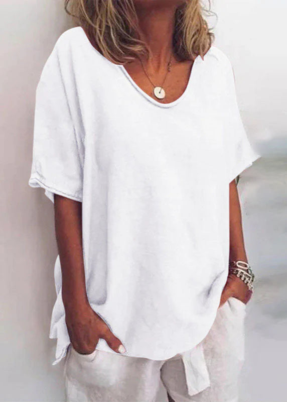 Close-up view of women's cotton summer blouse showing soft fabric drape and short sleeve detail
