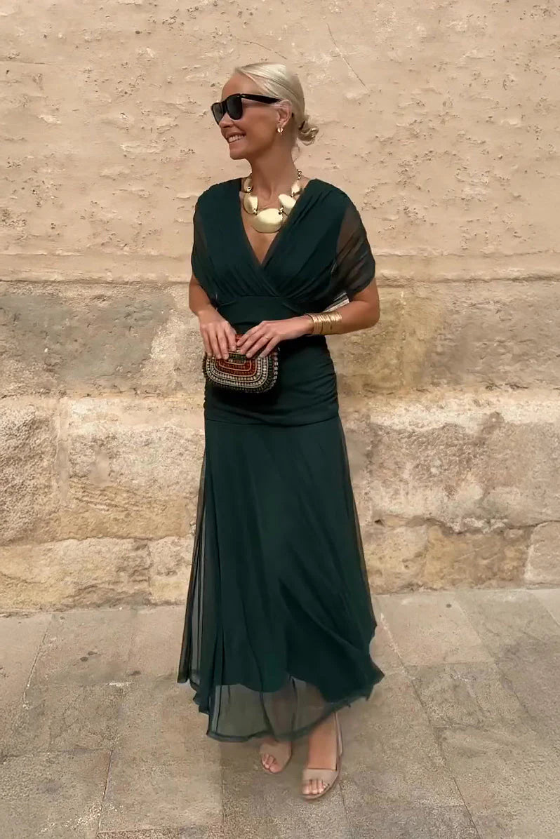 Harper maxi ceremony dress in deep green with V-neckline and flowing floor-length skirt for formal events