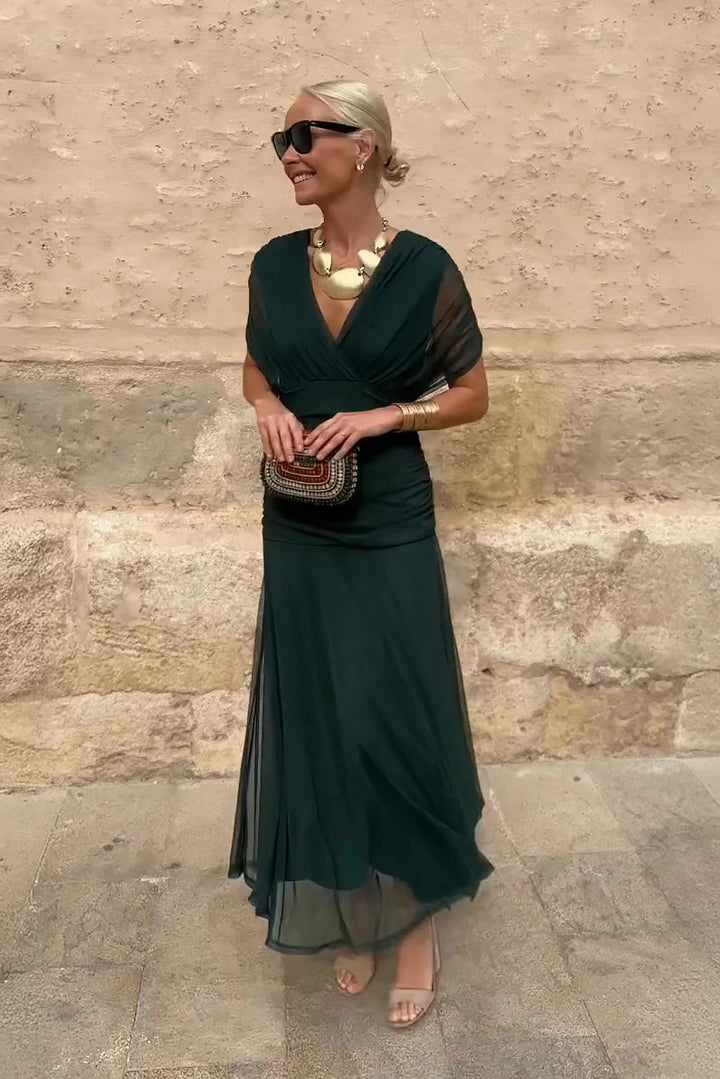 Harper maxi ceremony dress in deep green with V-neckline and flowing floor-length skirt for formal events