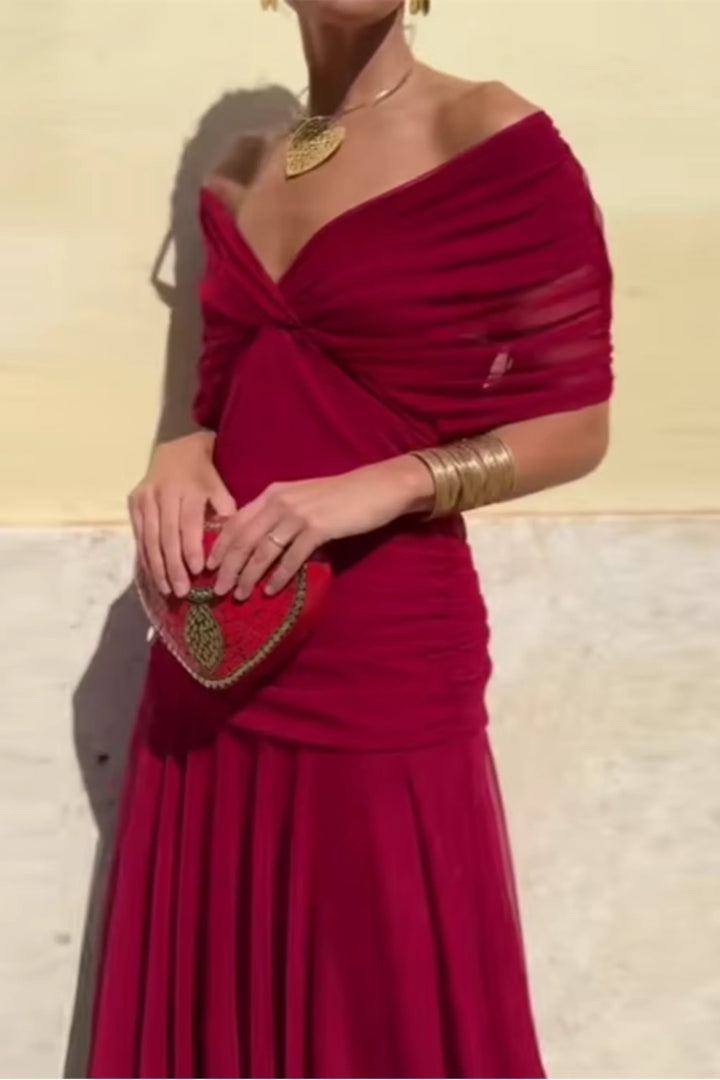 Three-quarter view of maxi ceremony dress highlighting V-neckline and fitted bodice