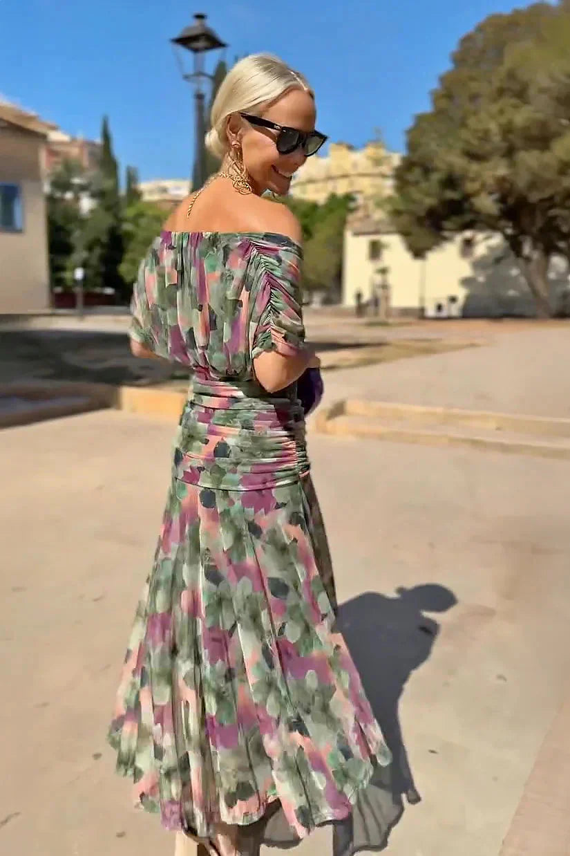 Model wearing maxi ceremony dress styled with statement necklace for formal occasion