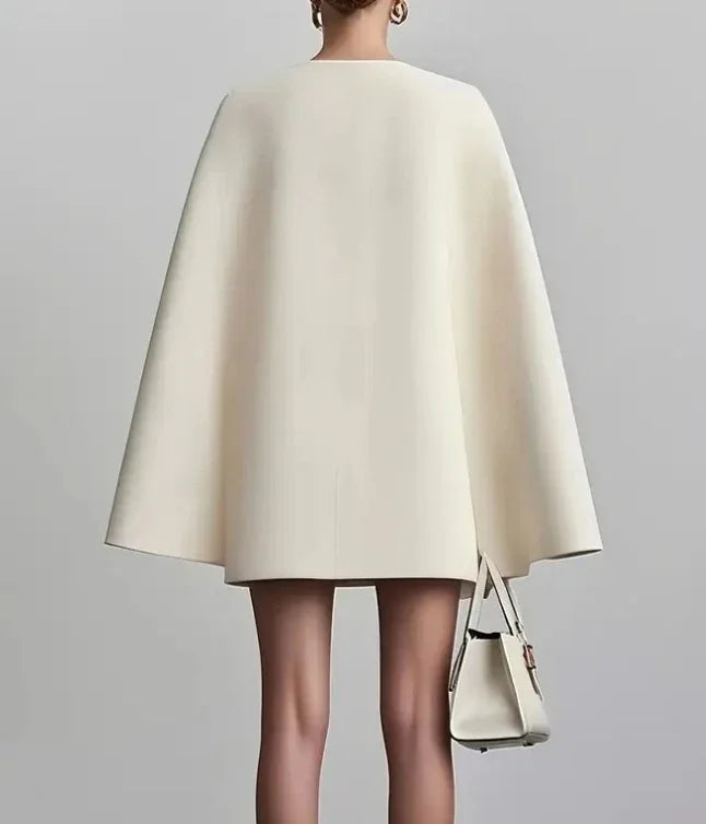 Close-up view of V-Neck Blazer Dress showing deep neckline and structured bodice with button closure details