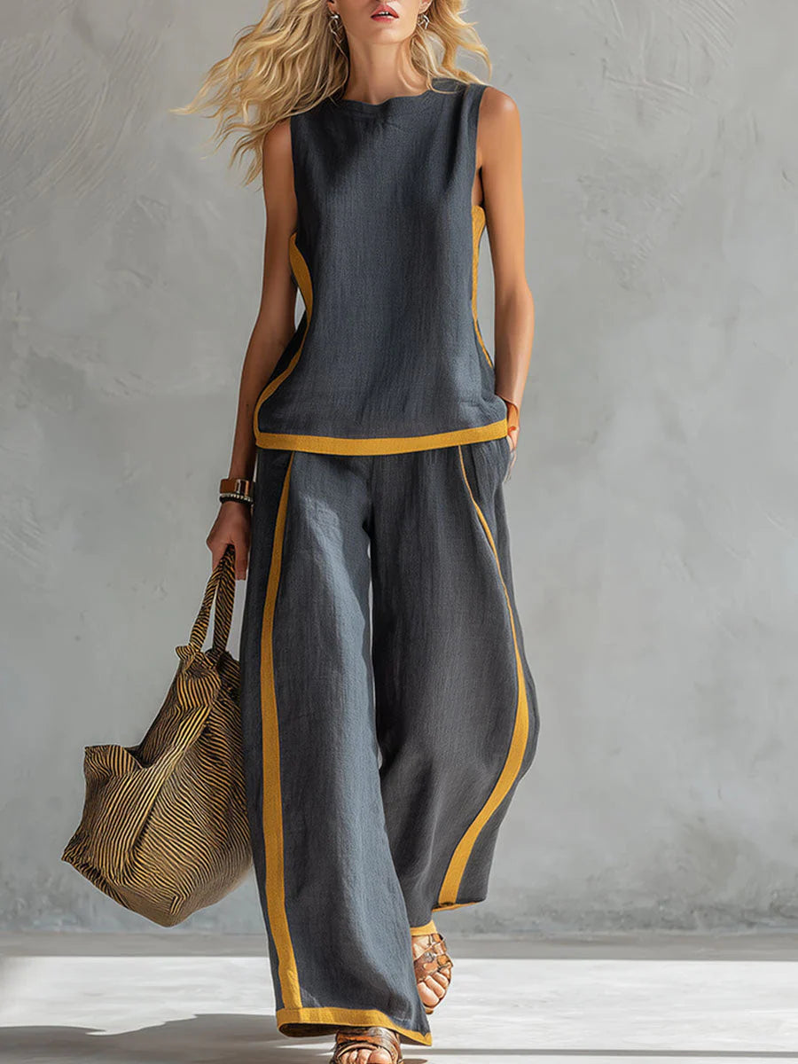 Women's wide-leg pants set with sleeveless top and mustard contrast trim detailing in charcoal gray