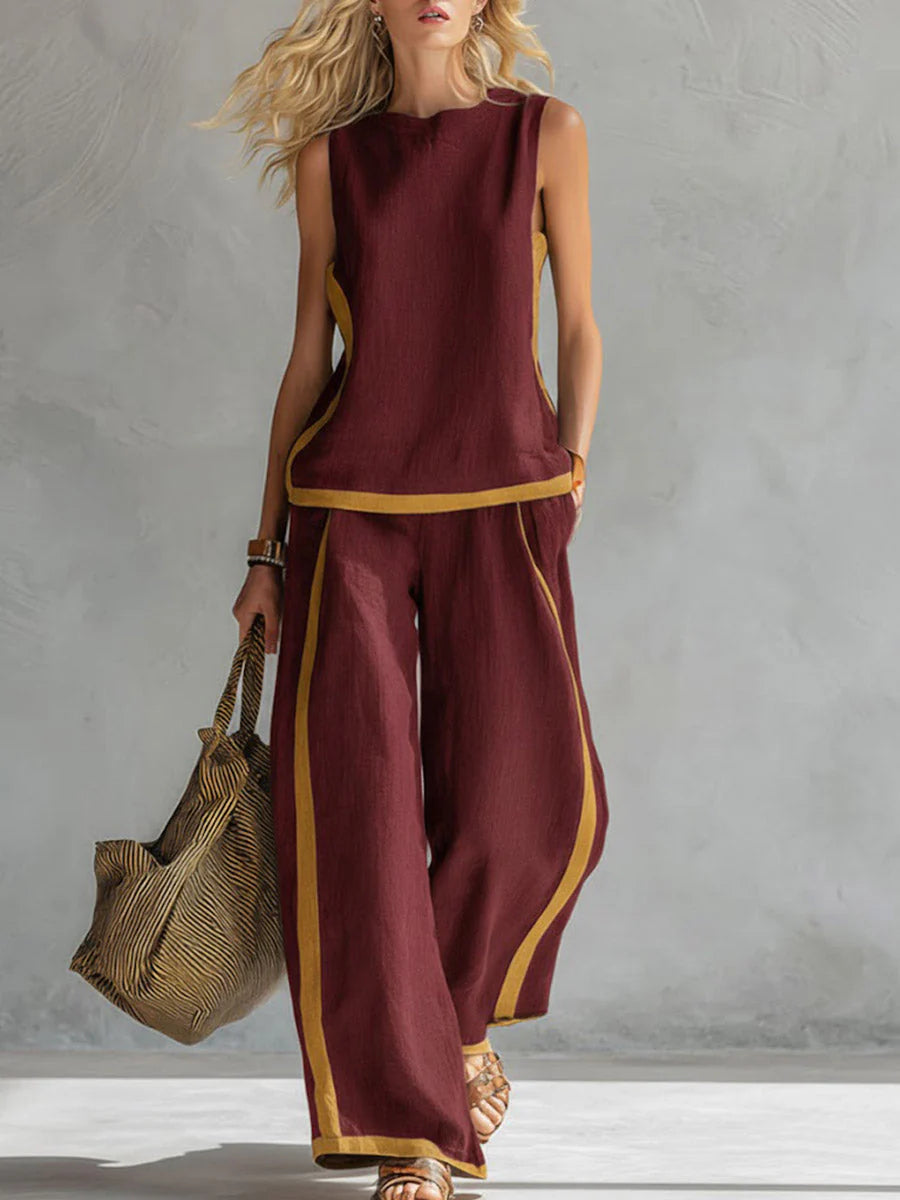 Side view of two-piece wide-leg pants set showing contrast trim along edges and relaxed silhouette