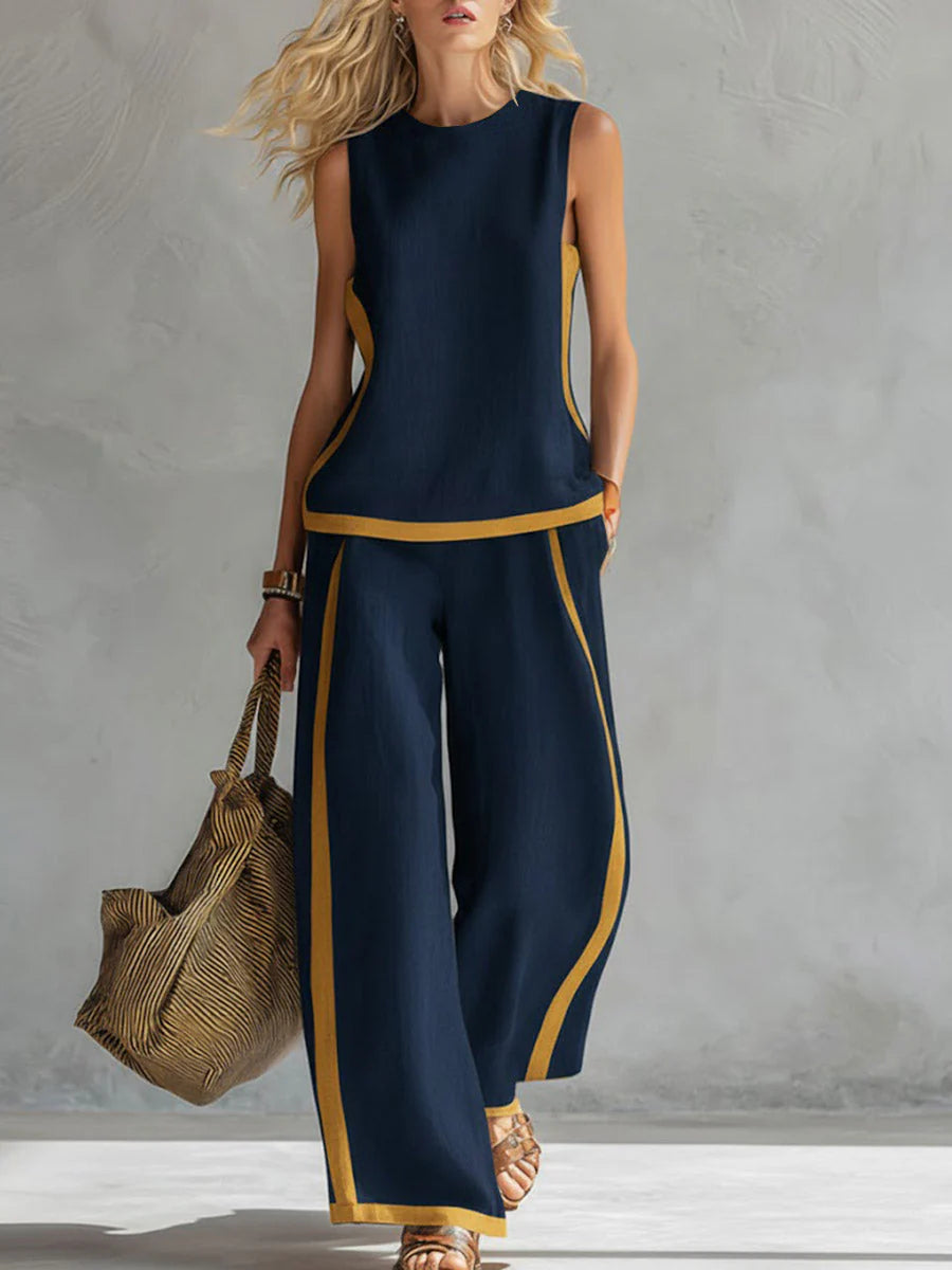 Detail shot of sleeveless top with round neckline and contrast trim on wide-leg pants set