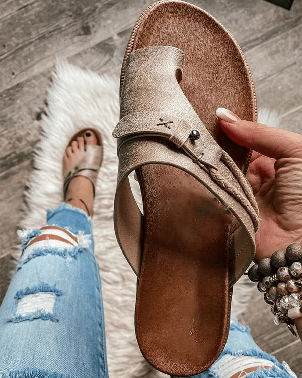 Overhead view of orthopedic sandals highlighting open-toe slide design and buckle closure details