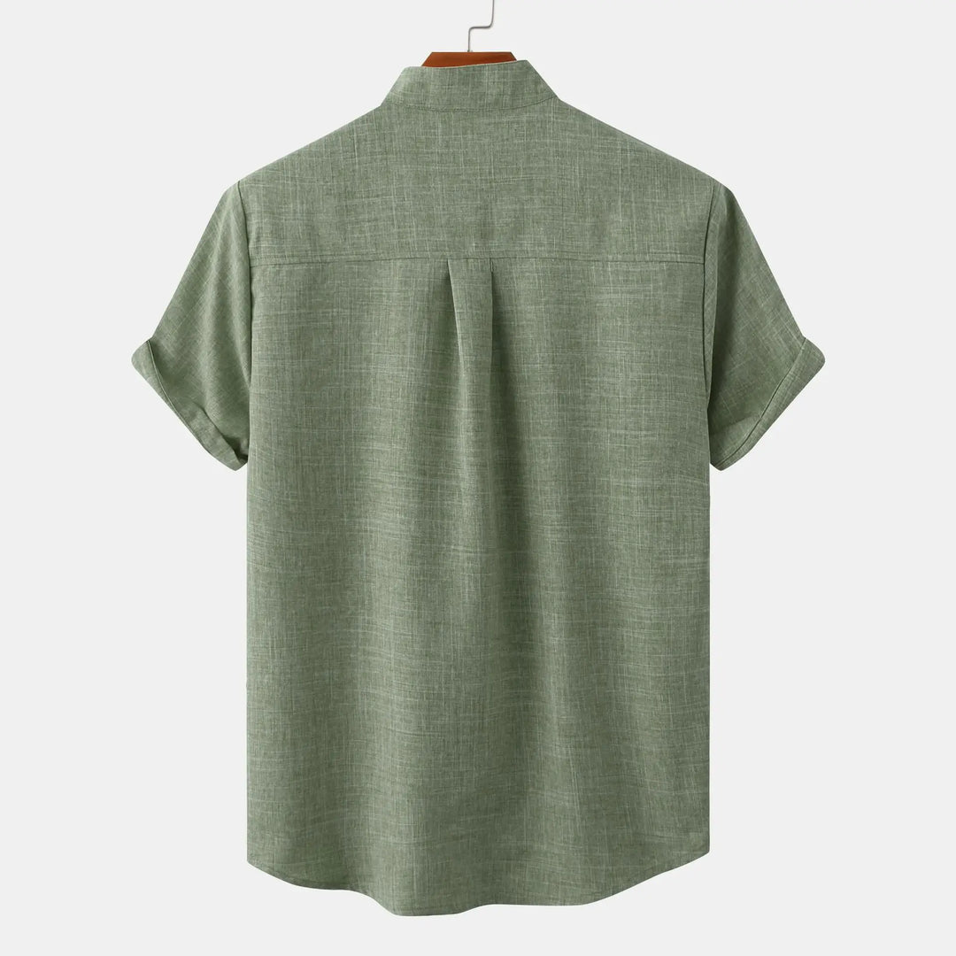 Side angle of men's relaxed fit short sleeve shirt displaying structured fabric drape