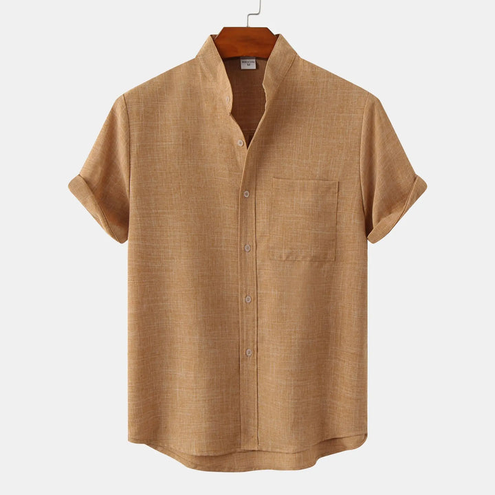 Detail shot of men's short sleeve shirt chest pocket and button placket construction