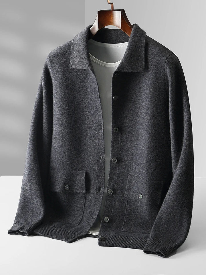 Men's knit cardigan showing dual chest pockets with button closures and smooth fabric texture