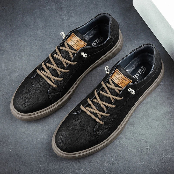 Close-up of men's low-top sneaker showing lace-up detail and tongue branding