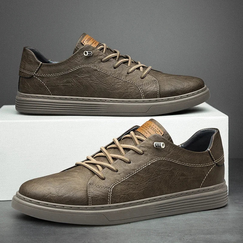 Angled view of men's casual black sneakers with multi-level ridged rubber outsole