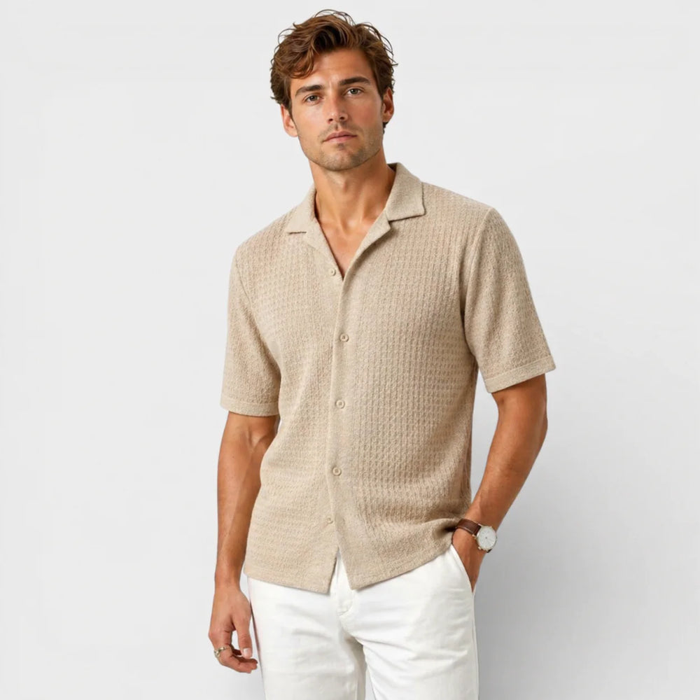 Close-up view of men's textured knit camp collar shirt showing fabric detail and button placket