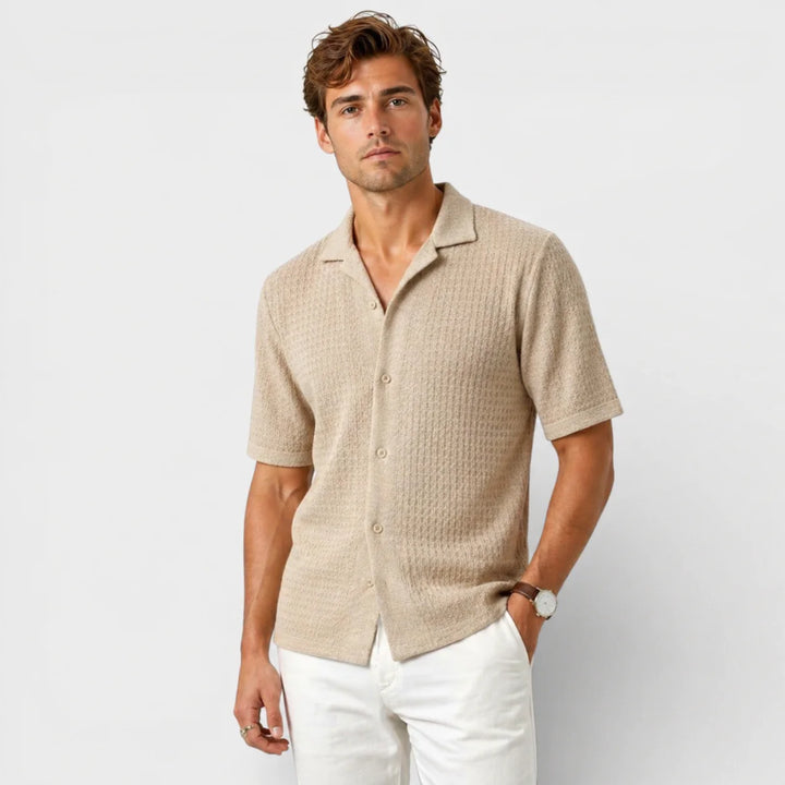 Close-up view of men's textured knit camp collar shirt showing fabric detail and button placket