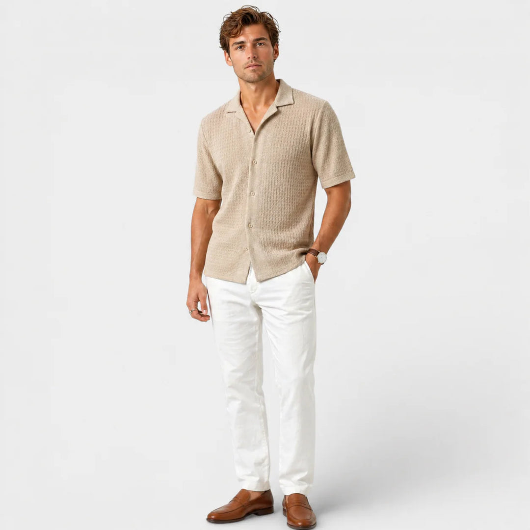 Detail shot of men's camp collar shirt showing textured knit construction and tonal buttons