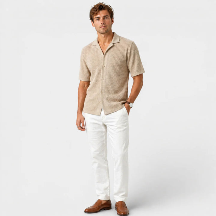 Detail shot of men's camp collar shirt showing textured knit construction and tonal buttons