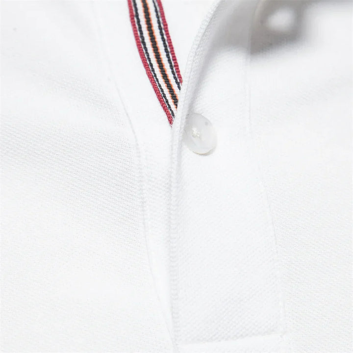 Men's polo shirt embroidered with chest branding showing regular fit and structured drape