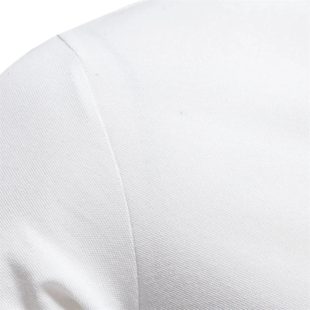 Detail shot of pointed collar and placket on men's short-sleeve polo shirt embroidered with logo