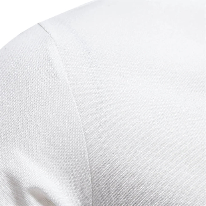 Detail shot of pointed collar and placket on men's short-sleeve polo shirt embroidered with logo